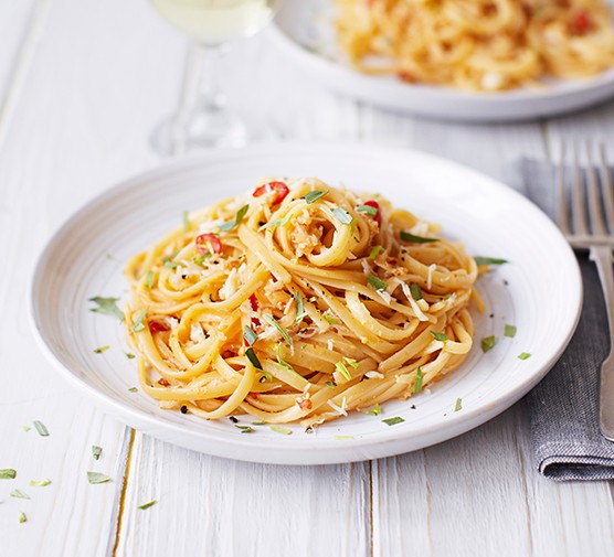 37 crab recipes Two dishes of crab linguine topped with tarragon