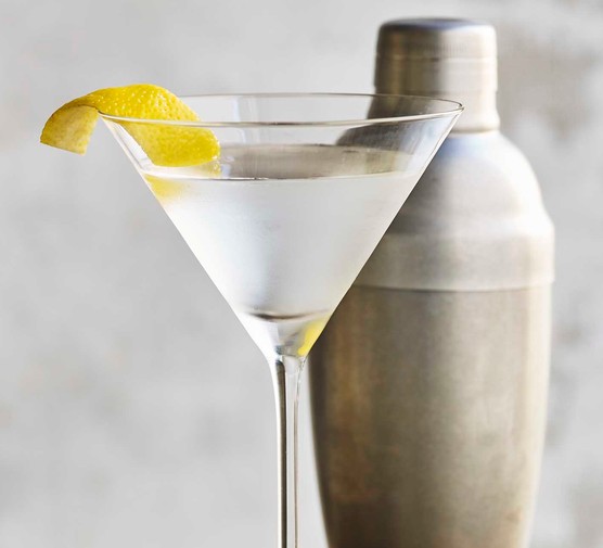 Best cocktail accessories A martini cocktail next to a shaker