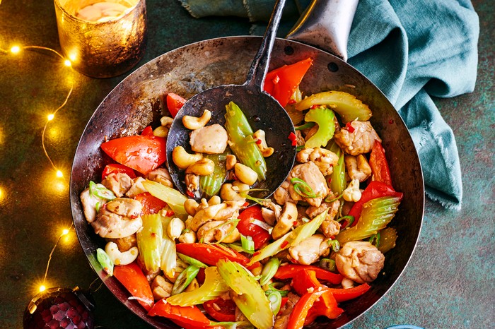 Chicken, celery and cashew stir-fry A wok full of chicken, vegetables, celery and toasted cashews
