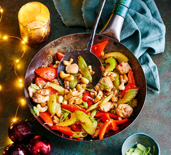Chicken, celery and cashew stir-fry A wok full of chicken, vegetables, celery and toasted cashews