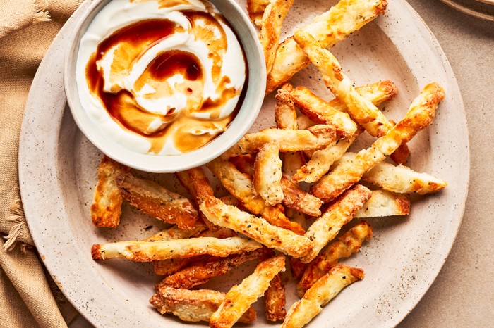 Air fryer halloumi fries Plate of halloumi fries with a greek yoghurt dip