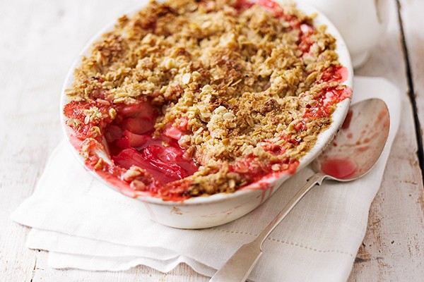 Rhubarb crumble Rhubarb crumble in an oval bowl with a spoon taken out