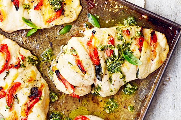 Pesto chicken Tray of stuffed hasselback chicken breasts with pesto