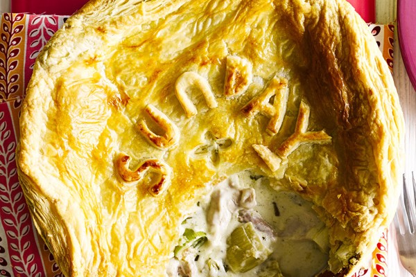 Chicken and leek pie Chicken and leek puff pie with spoonful taken out