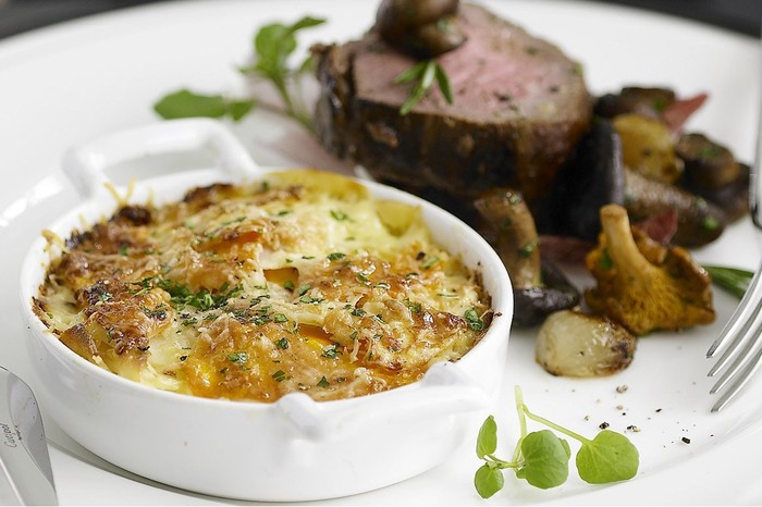 Gratins Parsnip gratin in dish on plate