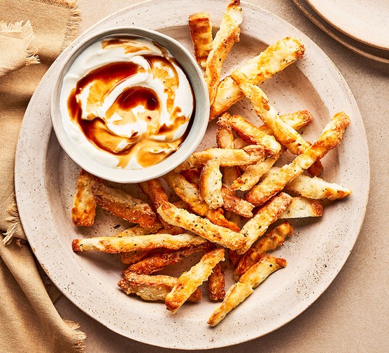 Air-fryer halloumi fries A plate of halloumi fries with a Greek yogurt dip