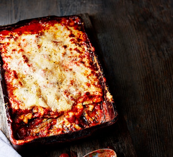 Aubergine Parmigiana Aubergine Parmigiana topped with Melted Cheese in a Roasting Dish