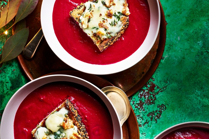 Beetroot soup Two bowls of beetroot soup, topped with sourdough toast and blue cheese