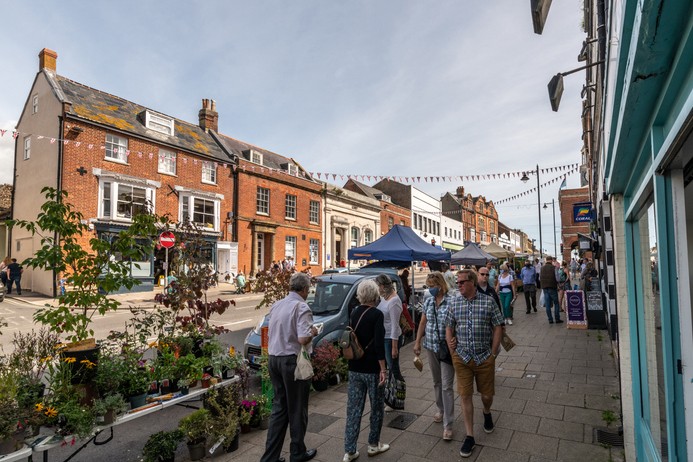Street market stalls in Bridport, Dorset Bridport, UK. Saturday 12 September 2020. People walking and looking at the Street market stalls in Bridport, Dorset.