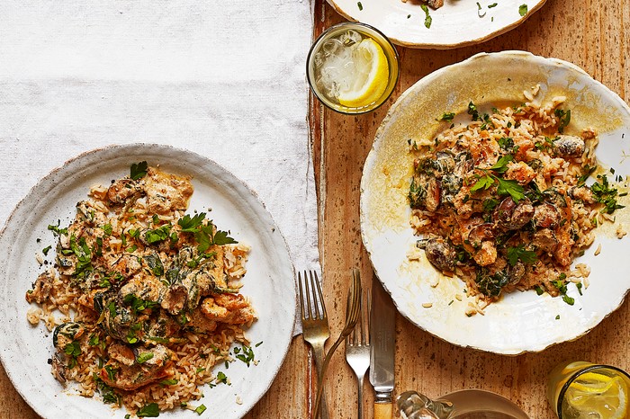 Plates of chicken, mushroom and spinach stroganoff ready to serve