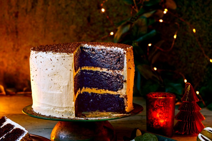 Chocolate and Baileys cake An impressive three-layered iced chocolate cake with fairy lights in the background