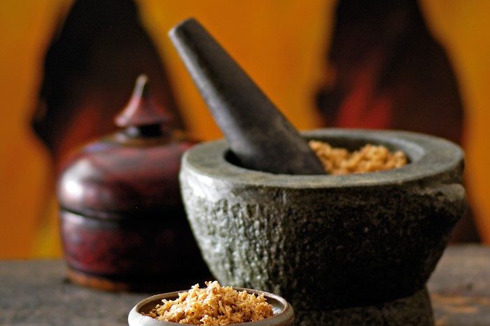 Coconut Sambal Recipe (Pol Sambal) Coconut sambal in a pestle and mortar