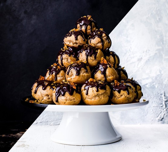 Profiterole tower with dark chocolate and hazelnut topping