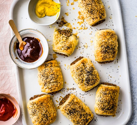 Best Healthy Picnic Food Vegan Sausage Rolls on a Baking Tray with BBQ Sauce for Dipping