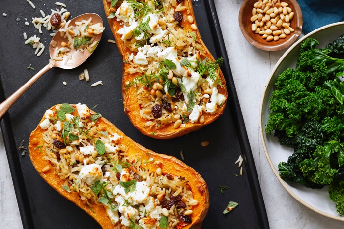 Stuffed butternut squash with feta Two butternut squash halves stuffed with feta, rice and sultanas