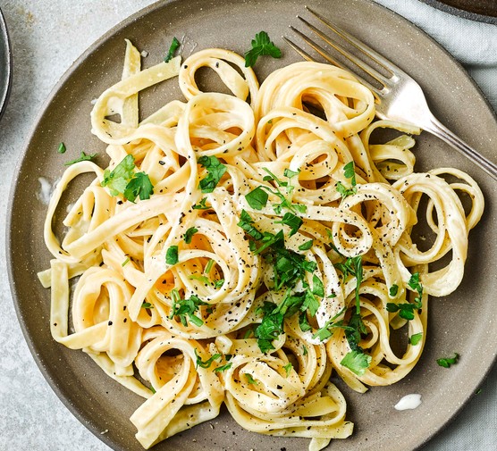 Fettucine Alfredo Recipe Two plates of Fettuccine Alfredo