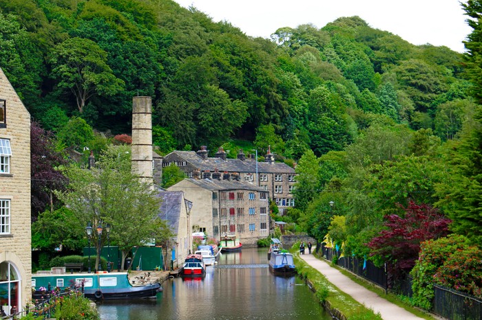 Hebden Bridge, England View looking down the River Calder in the revitalized industrial town of Hebden Bridge, Yorkshire, England. Hebden Bridge is known for being LGBT-friendly and for its concentration of independent shops.