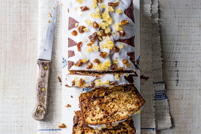 Date and ginger loaf cake Ginger and date loaf cakentopped with icing and chopped ginger
