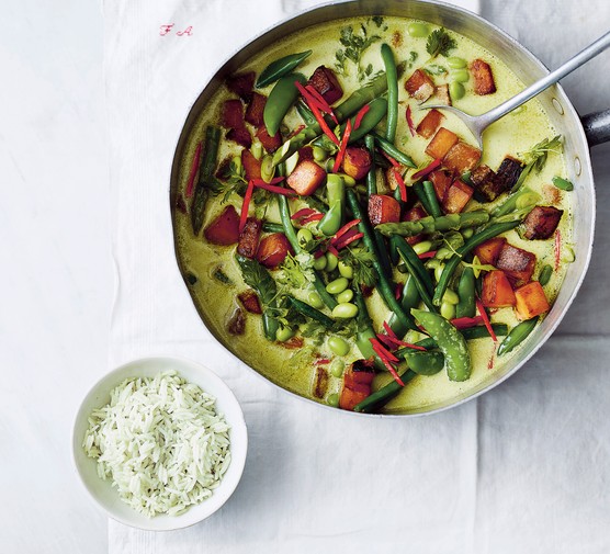 Vegan Thai Green Curry Vegan Thai Green Curry in a skillet next to a bowl of rice