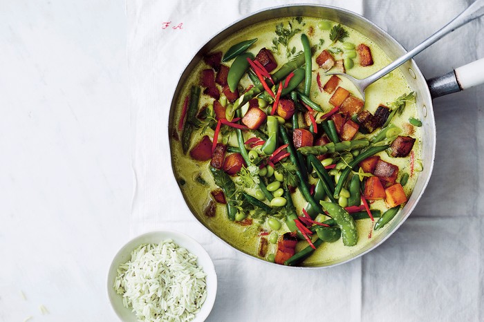 Vegan Thai Green Curry Vegan Thai Green Curry in a skillet next to a bowl of rice