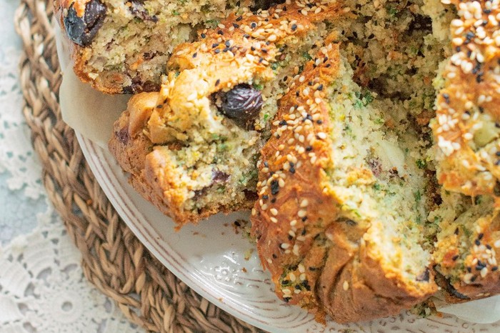 Halloumi and black olive cake Halloumi and black olive cake on a white plate, sliced into wedges