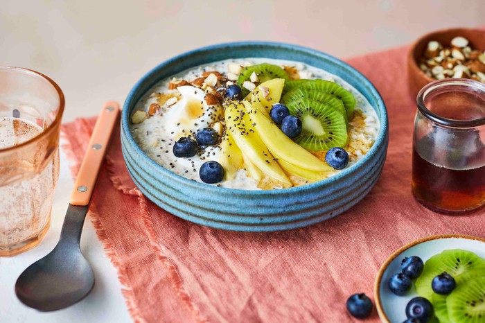 Winter sunshine breakfast bowl A bowl of overnight oats with fresh fruit on top