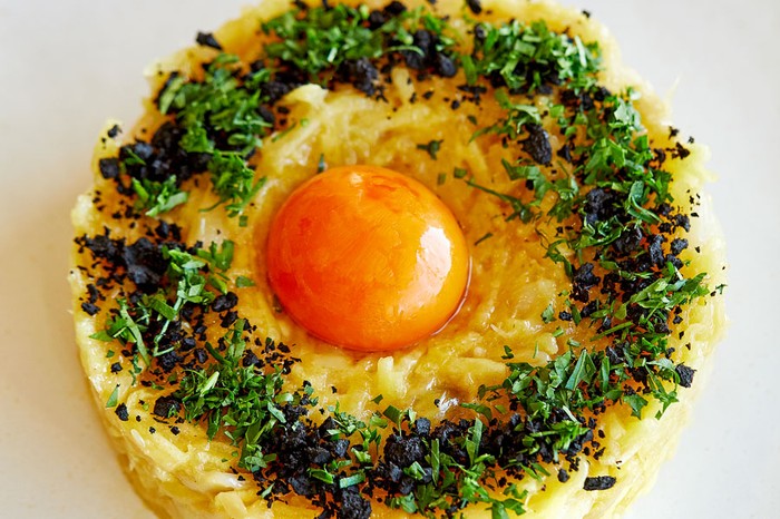 Bacalhau-à-brás Egg yolk on top of cod and rice