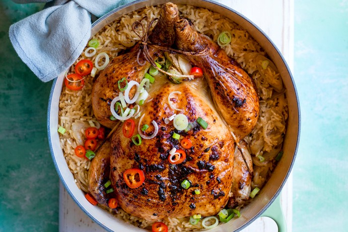 27 Best Exciting Chicken Recipes A whole roast chicken in a pot on a turquoise table