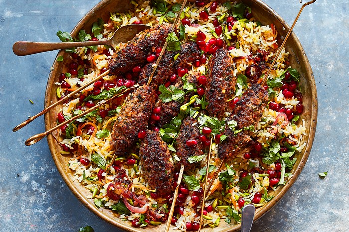 Lamb Koftas Recipe with Jewelled Rice A platter of lamb koftas with pomegranate rice