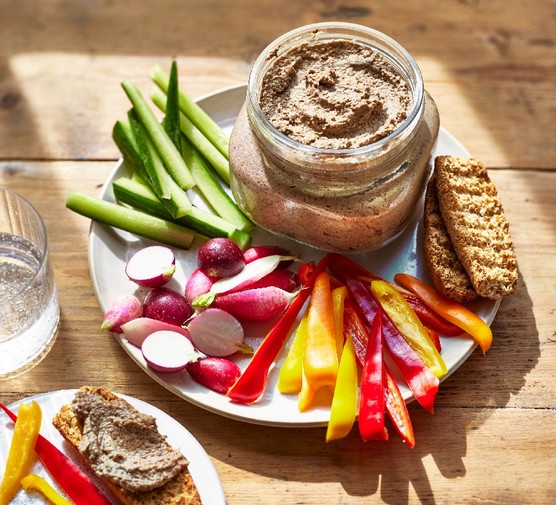 Mushroom pate recipe A glass pot of mushroom pate on a plate with crudites