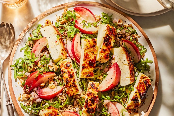 Nectarine and chilli maple halloumi quinoa salad A grilled halloumi salad with nectarines in a large sharing bowl