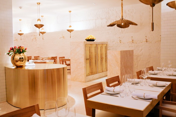 NOPI Interior NOPI restaurant interiors with white washed walls, copper lights and wooden chairs round a marble topped table