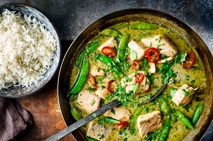 40 Dairy-Free Recipes Green Thai Fish Curry in a Pan with Rice on the Side
