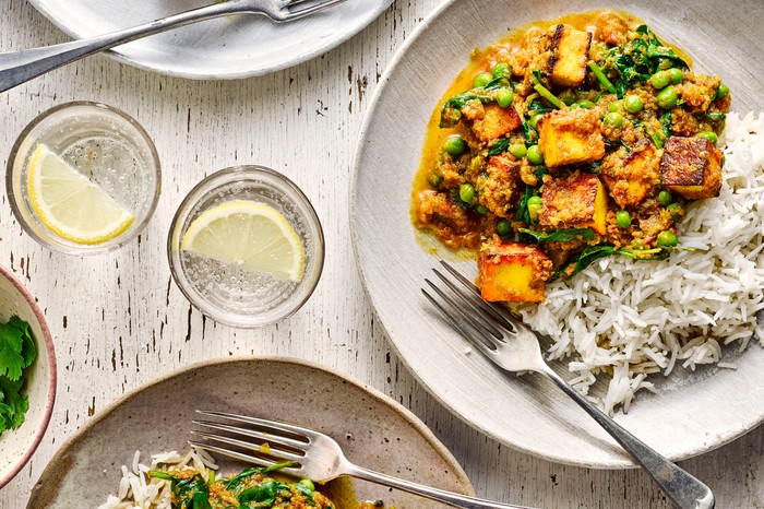 Light Paneer Curry Recipe two plates of paneer curry with rice