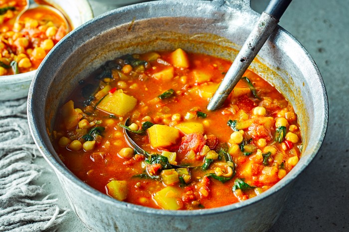 Moroccan veggie soup Moroccan veggie soup in a large silver pot with a silver serving spoon