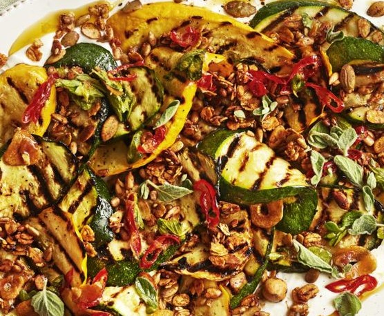 A platter of charred courgettes on a linen napkin