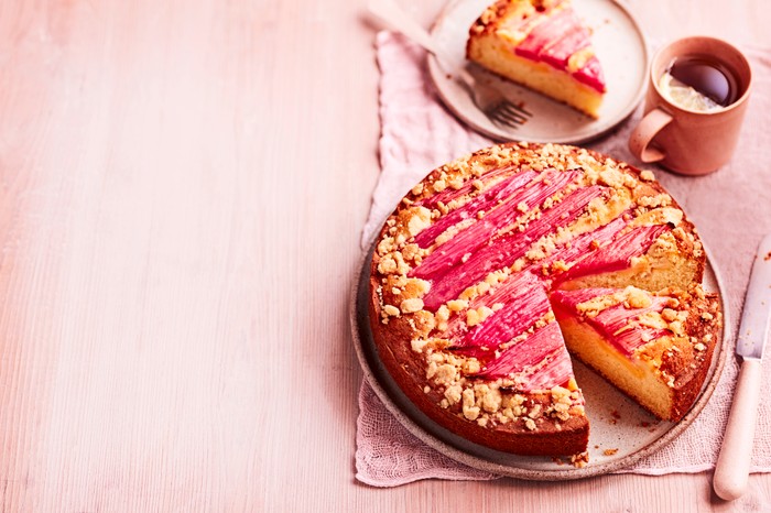 Rhubarb And Custard Cake Recipe A rhubarb cake with one slice taken out of it