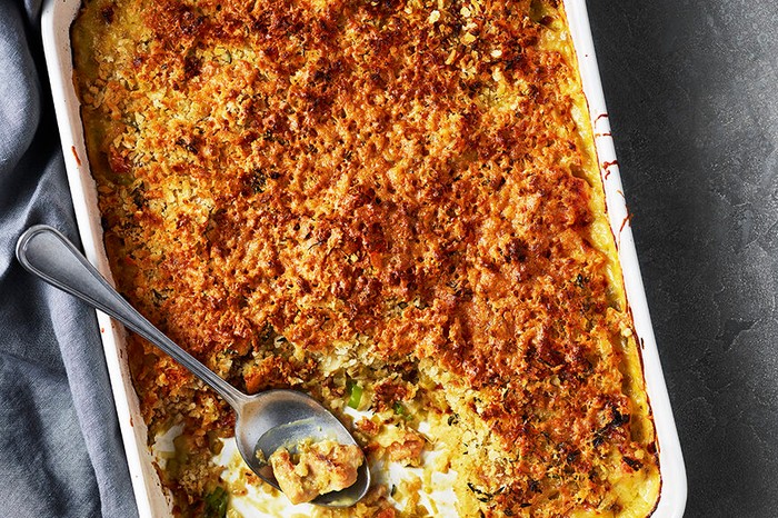 Chicken and leek bake A savoury baked dish with a serving spoon in it
