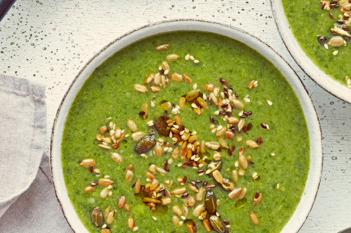 Leek, Pea and Spinach Soup Recipe A bowl of leek, spinach and pea soup, topped with seeds