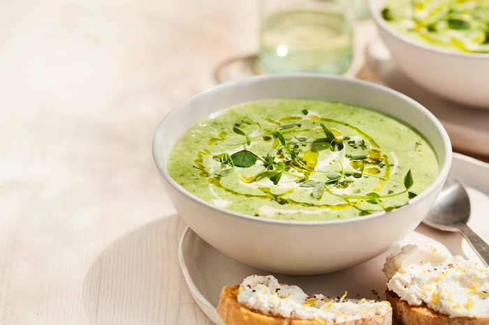 Pea and mint soup Pea and Mint Soup in a Bowl with Small Ricotta Toasts