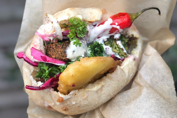 Pockets A pitta filled with falafel, cabbage salad, sauce, hummus and a fried potato slice