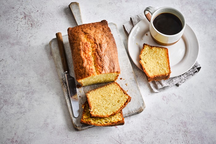 Pound cake A sliced pound cake with coffee on the side