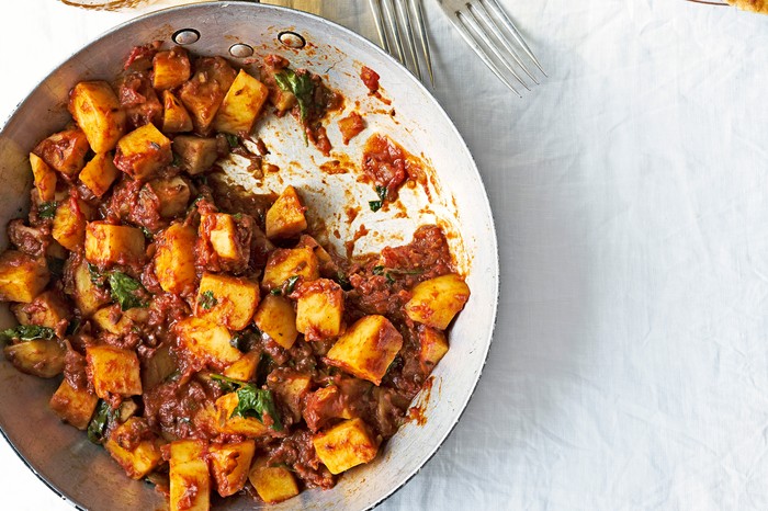 Potato Curry Recipe Potato Curry Recipe with tomatoes, coriander, chilli and ginger. With sides of rice, naan bread and cold beer