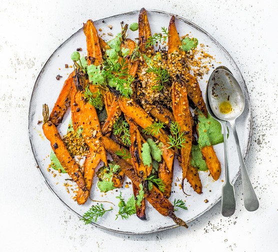 Roast Carrots Recipe Roast Carrots with carrot tops on a plate