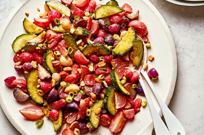 40 vegetarian salad recipes Large plate of radishes, peanuts, cucumber, tomato and spring onions