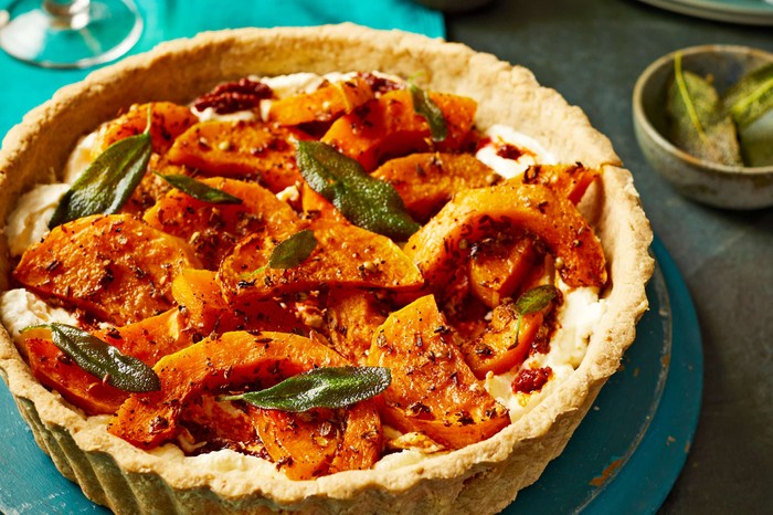 Butternut squash tart A whole butternut squash tart with crispy sage leaves on top