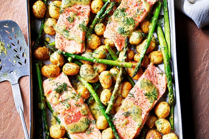 Fish traybake recipe with sea trout, new potato and asparagus Fish traybake recipe with sea trout, new potato and asparagus