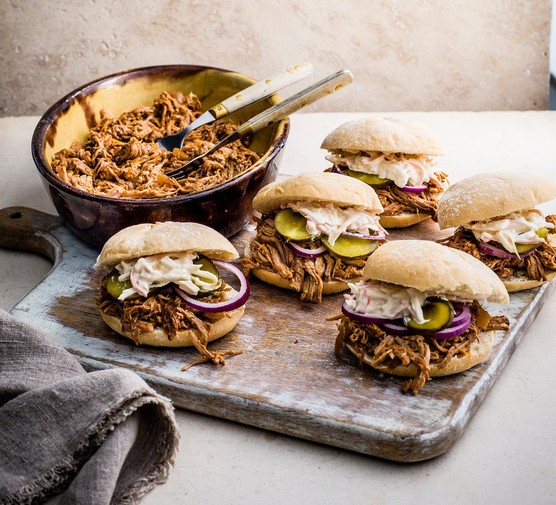 Slow-cooker-Pulled-pork Slow cooker pulled port in rolls with pickles and slaw