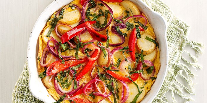 Spanish Pepper and Potato Omelette Spanish Pepper and Potato Omelette in a White Dish