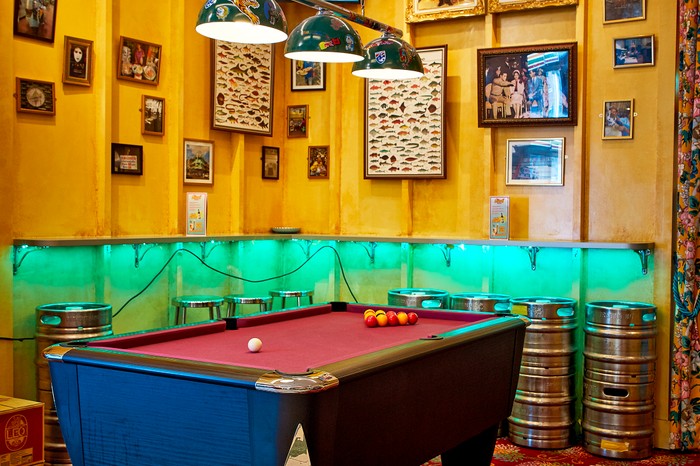 Speedboat Bar The pool table and decorative wall art in Speedboat Bar in Chinatown